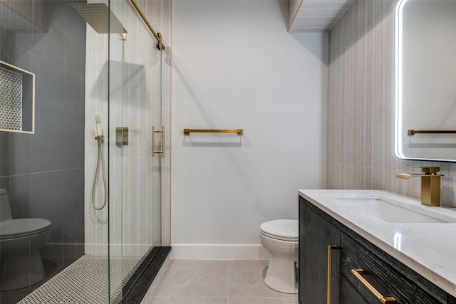 bathroom with toilet, tile patterned floors, and a shower with shower door