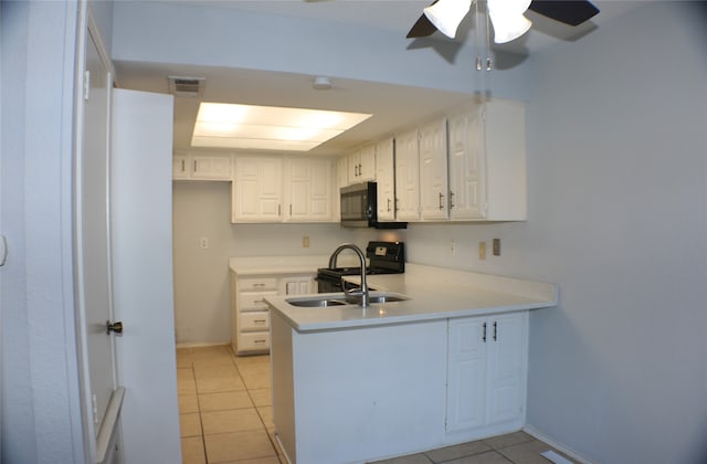 kitchen with white cabinets, light tile patterned floors, ceiling fan, and sink