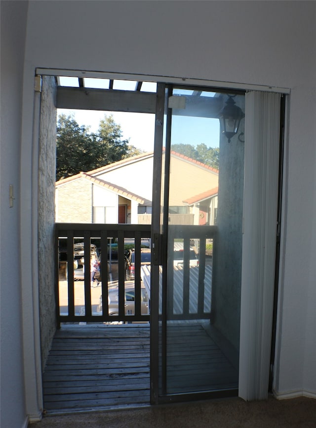 entryway with carpet flooring and plenty of natural light