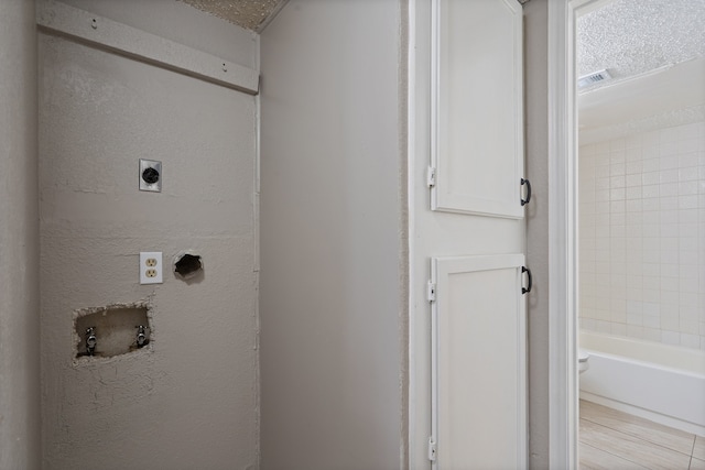 laundry room featuring electric dryer hookup