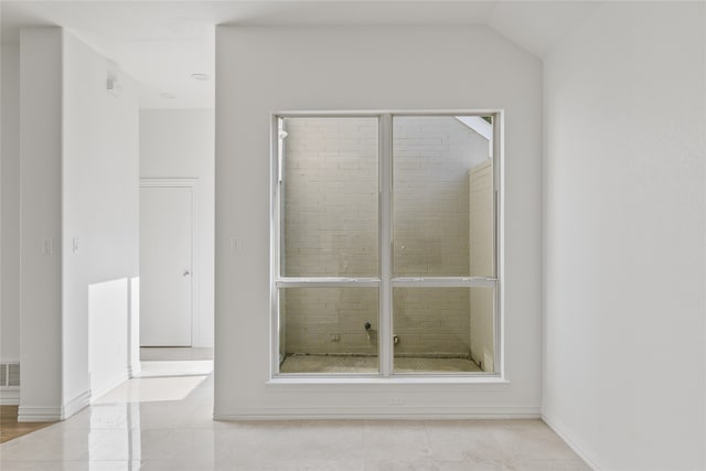 bathroom with lofted ceiling