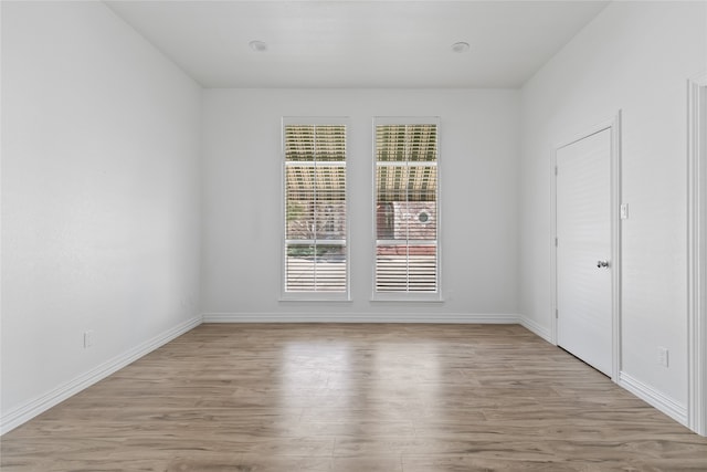 spare room featuring light hardwood / wood-style flooring