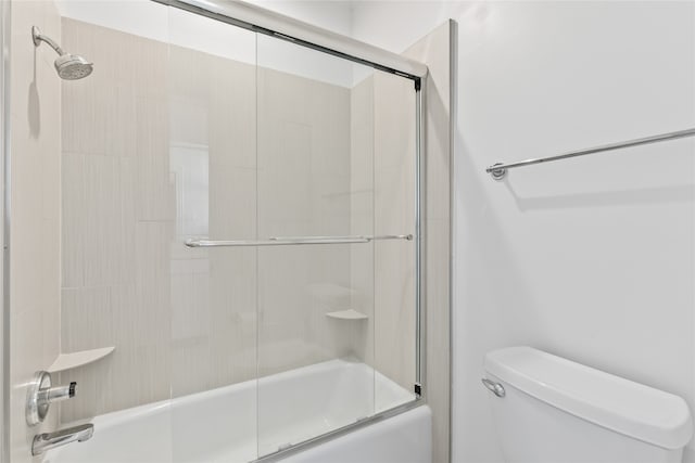 bathroom with toilet and enclosed tub / shower combo