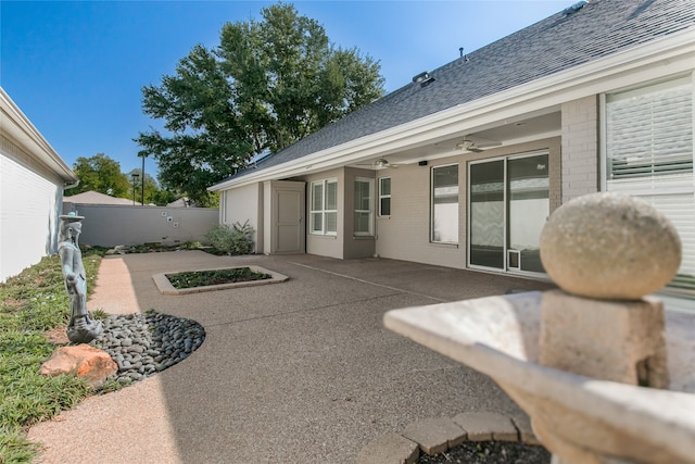 exterior space featuring ceiling fan