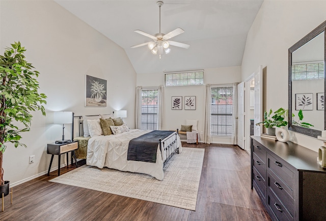 bedroom featuring access to exterior, dark hardwood / wood-style flooring, high vaulted ceiling, and ceiling fan