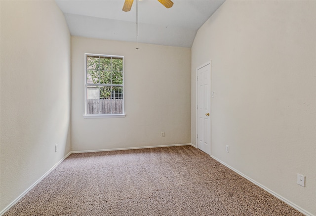 spare room with carpet, ceiling fan, and lofted ceiling