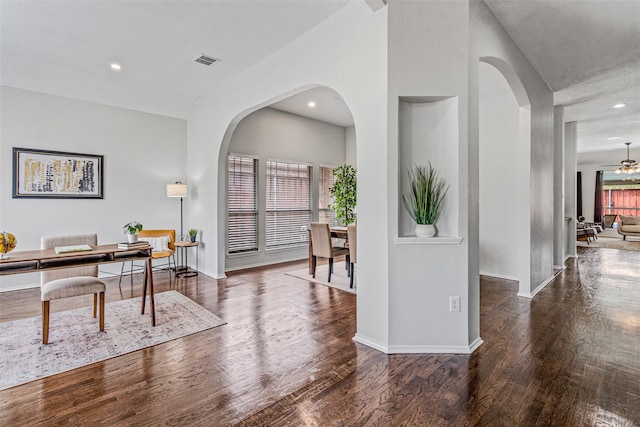 office area with ceiling fan and dark wood-type flooring