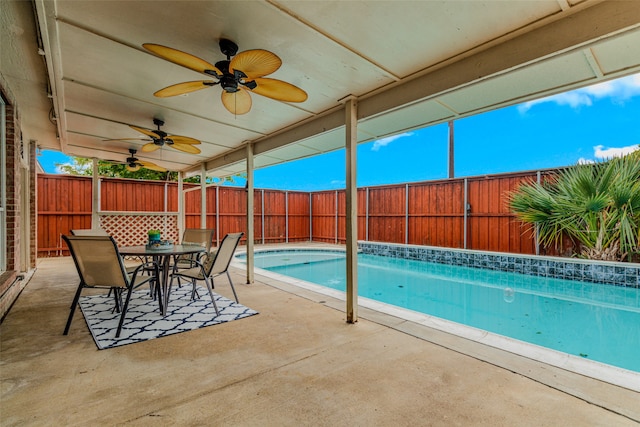 view of pool with ceiling fan and a patio