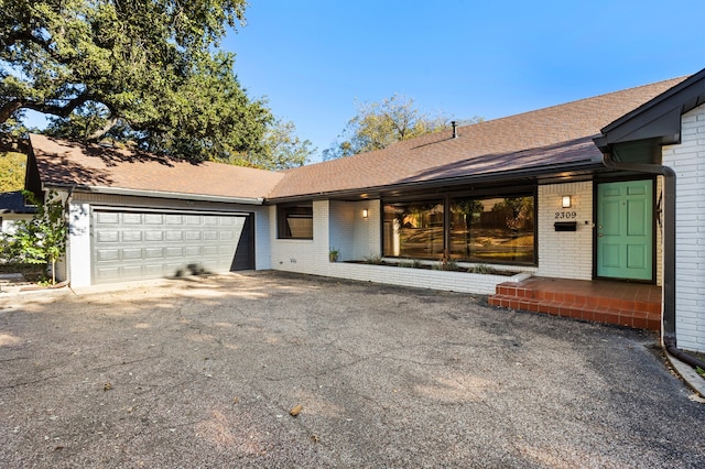 single story home featuring a garage