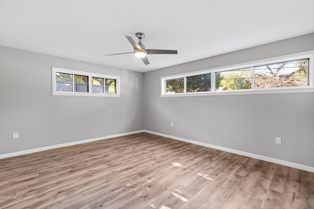 empty room featuring light hardwood / wood-style flooring and ceiling fan