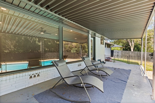 view of patio / terrace with a fenced in pool