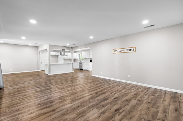 unfurnished living room with dark hardwood / wood-style flooring