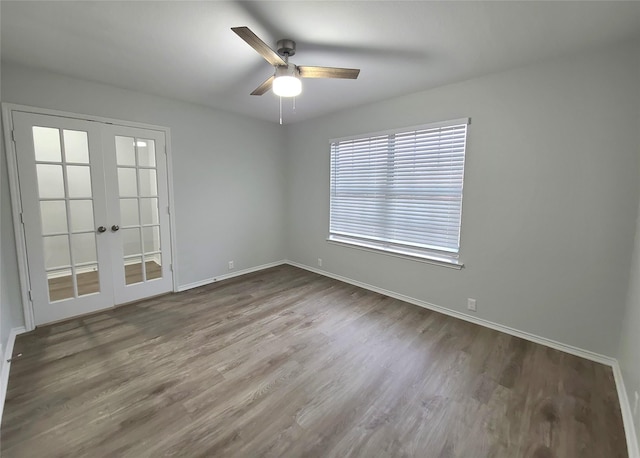 spare room with french doors, ceiling fan, and wood-type flooring