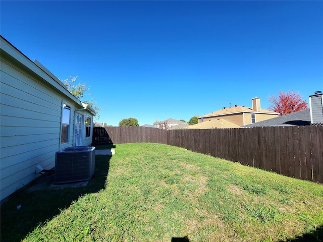 view of yard with central AC unit