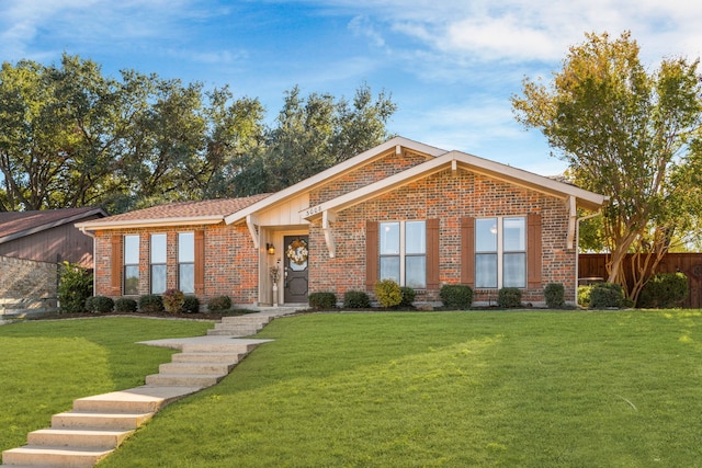 ranch-style house featuring a front lawn