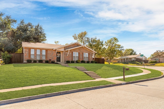 ranch-style home featuring a front lawn