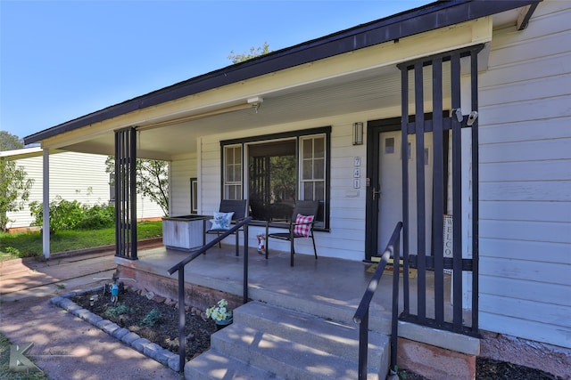 view of patio featuring a porch