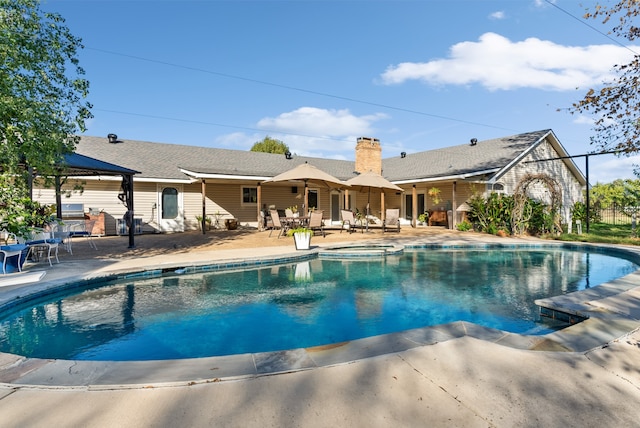 view of swimming pool featuring a patio area