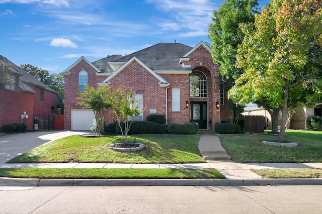 front facade featuring a front lawn and a garage