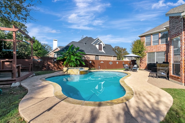 view of pool featuring an in ground hot tub and a patio