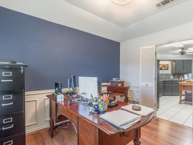 office featuring ceiling fan and light hardwood / wood-style floors