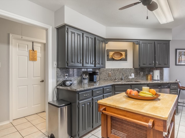 kitchen with tasteful backsplash, ceiling fan, light tile patterned floors, dishwasher, and gray cabinets