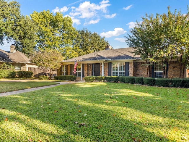 ranch-style house with a front lawn