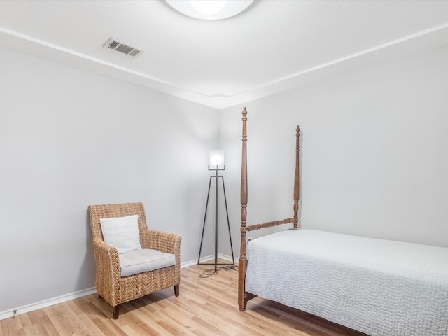 bedroom with hardwood / wood-style floors