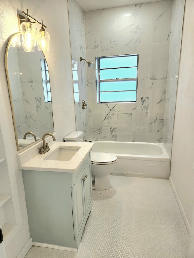 full bathroom with toilet, vanity, tile patterned floors, and tiled shower / bath