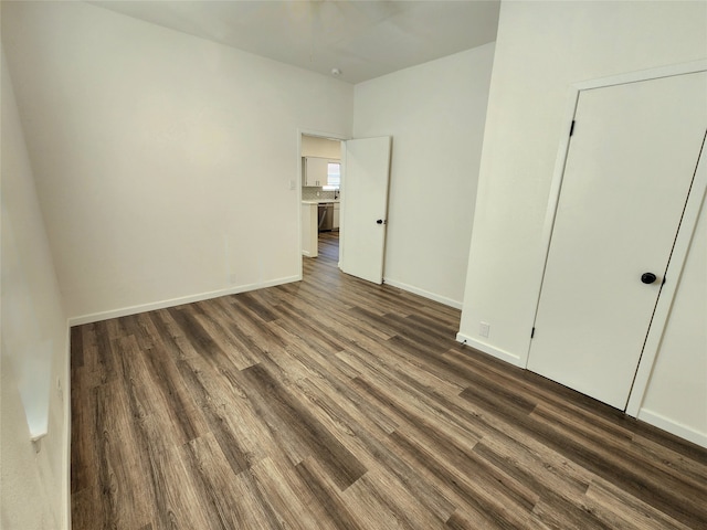 unfurnished bedroom featuring dark hardwood / wood-style flooring