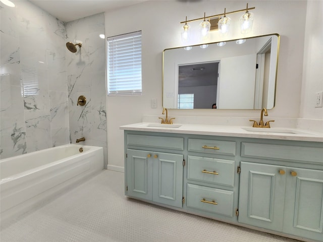 bathroom with vanity, tiled shower / bath combo, and tile patterned floors