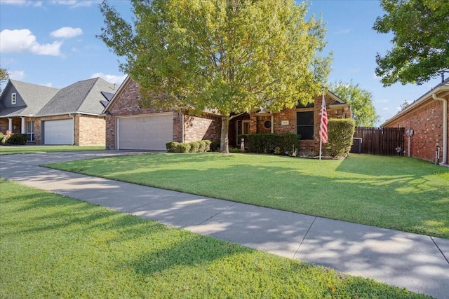 view of front of home with a garage and a front yard