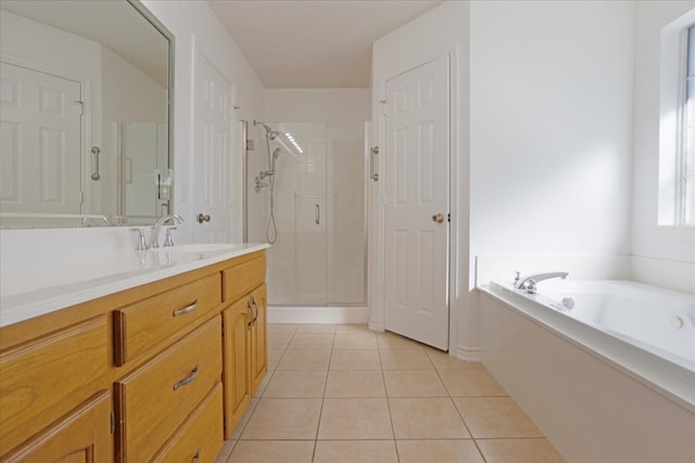 bathroom with tile patterned flooring, vanity, and independent shower and bath