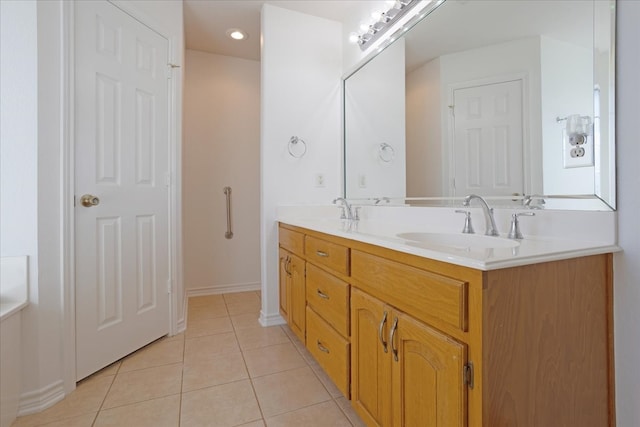 bathroom featuring tile patterned flooring and vanity