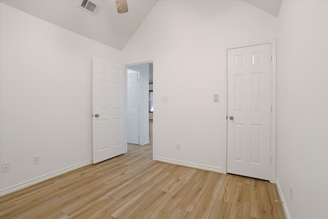 spare room featuring ceiling fan, light hardwood / wood-style flooring, and lofted ceiling