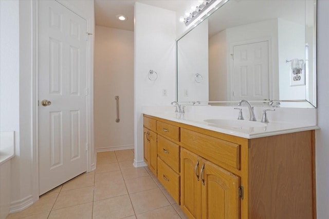 bathroom with tile patterned flooring and vanity