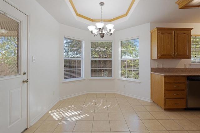 unfurnished dining area featuring light tile patterned floors, a raised ceiling, and a notable chandelier