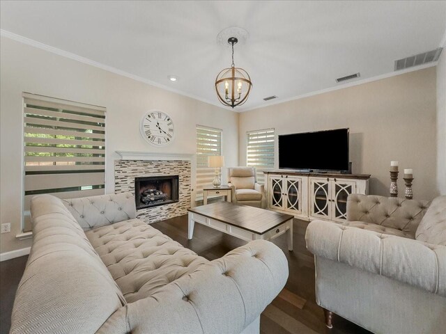 living room featuring ornamental molding and dark wood-type flooring