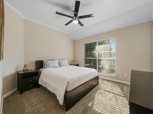 bedroom featuring dark colored carpet, vaulted ceiling, ceiling fan, and ornamental molding