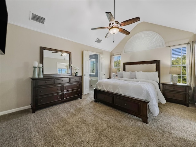 bedroom featuring ceiling fan, light colored carpet, multiple windows, and vaulted ceiling