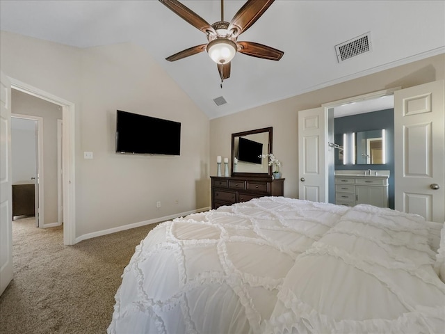 carpeted bedroom with ensuite bath, ceiling fan, and lofted ceiling