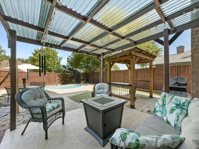 view of patio / terrace with an outdoor living space, a swimming pool side deck, and a pergola