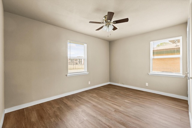 unfurnished room with light hardwood / wood-style floors, plenty of natural light, and ceiling fan