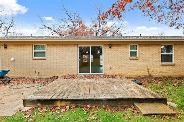 rear view of property with a deck