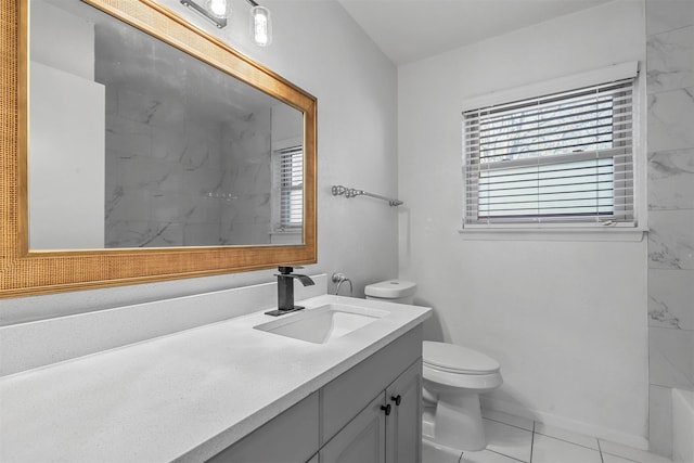 bathroom featuring tile patterned flooring, vanity, and toilet