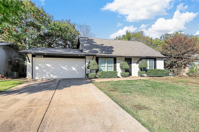 ranch-style house with a garage, a front yard, and central AC