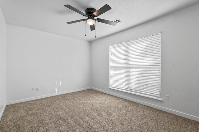 carpeted empty room with ceiling fan