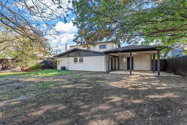 back of house featuring a patio area and ceiling fan