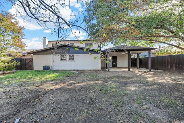 back of property featuring a patio area and cooling unit