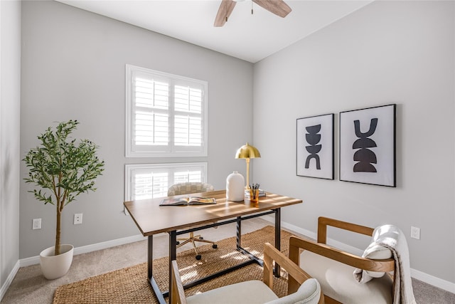 carpeted home office with ceiling fan